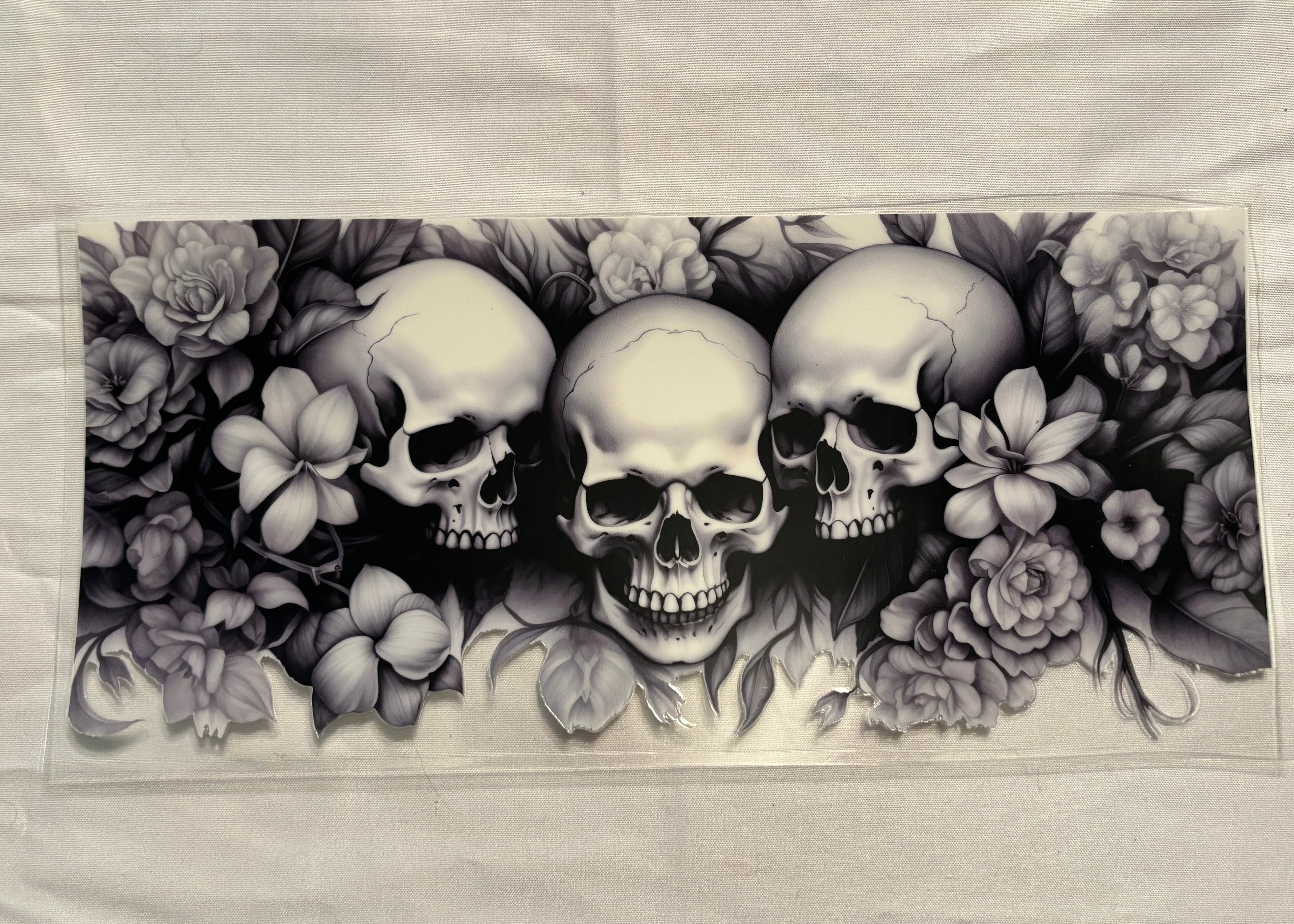 Black and white skulls with flowers